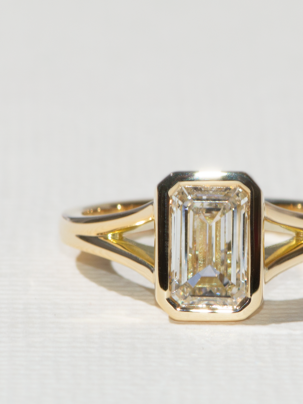 Eye clean emerald diamond in a setting.