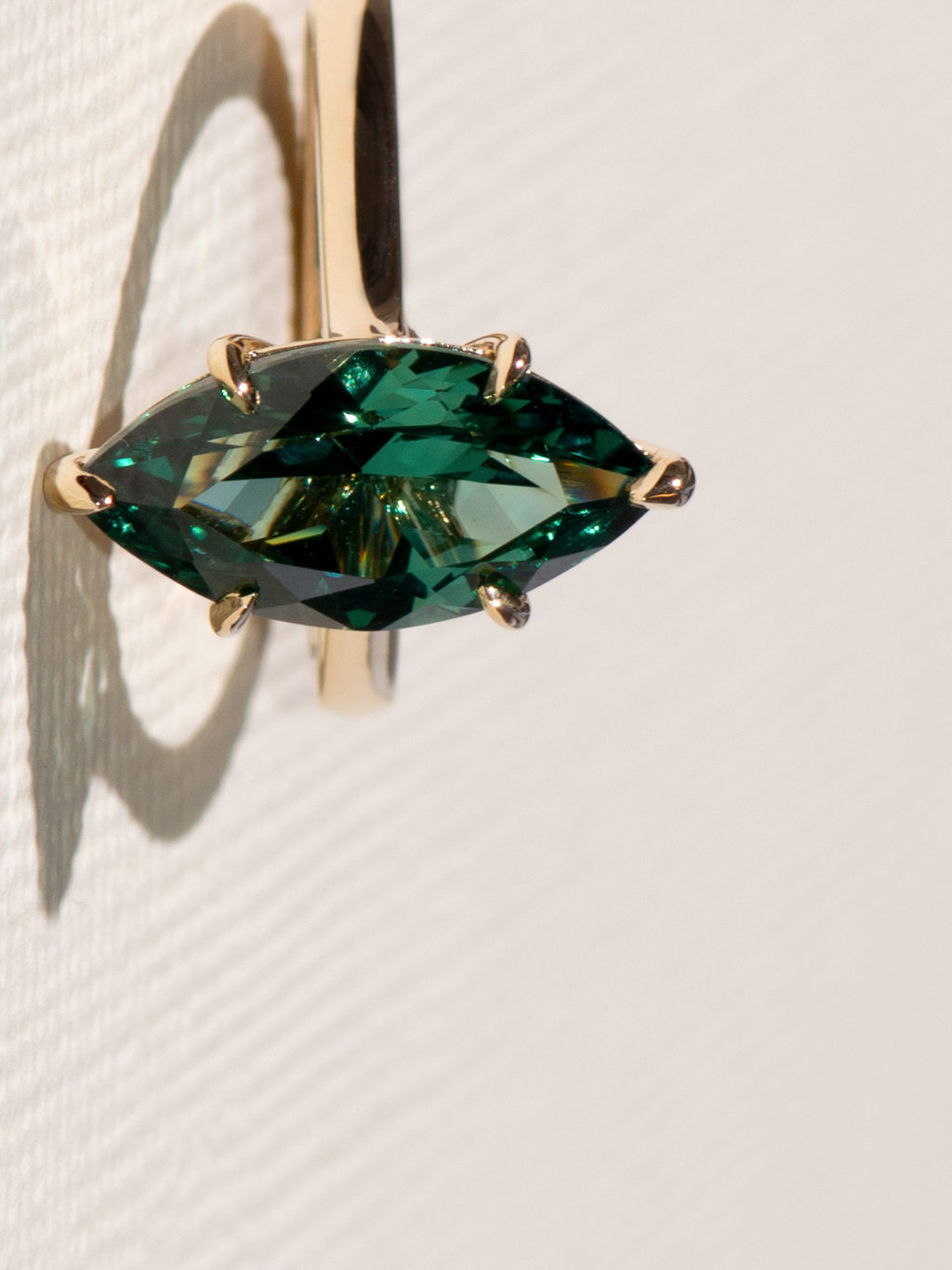 Green lab sapphire in a simple solitaire setting.