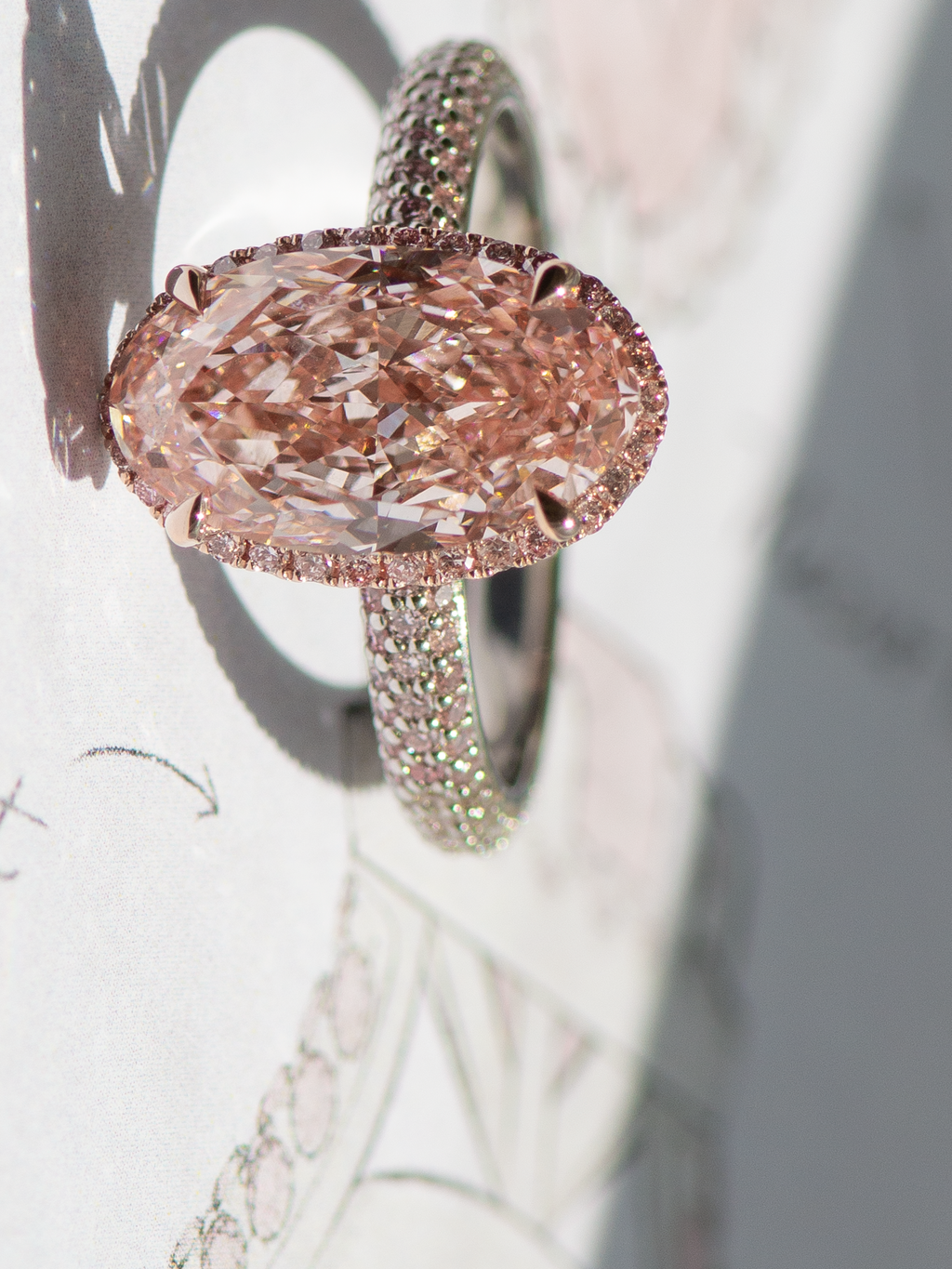 Pink moval diamond, cut with a modified brilliant cut method to avoid a bowtie.