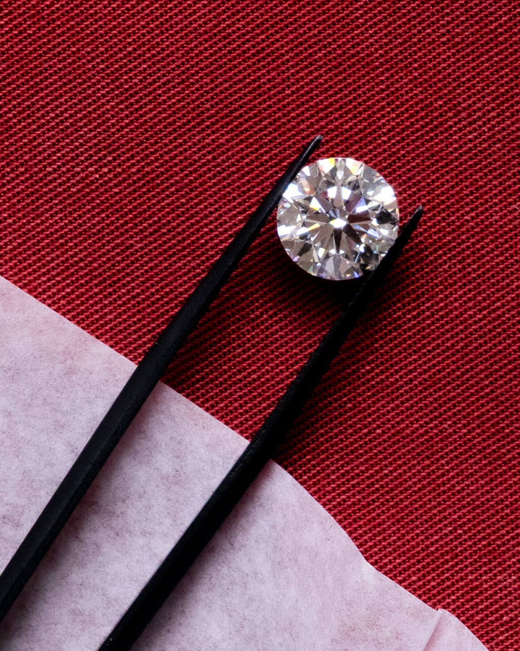 A round diamond with perfectly symmetrical facets — the best cut possible.