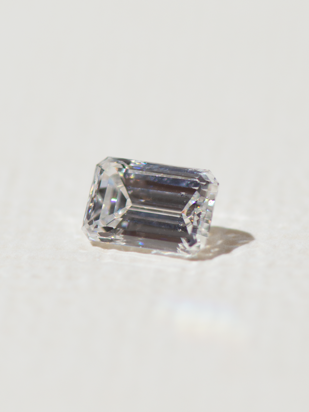 An emerald with an inclusion visible to the naked eye.