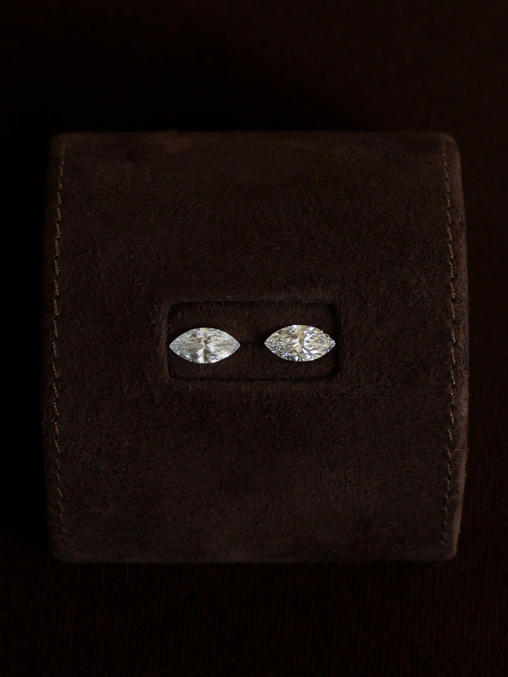 Elongated moissanites (left) shapes like tend to look less crisp than diamonds (right).